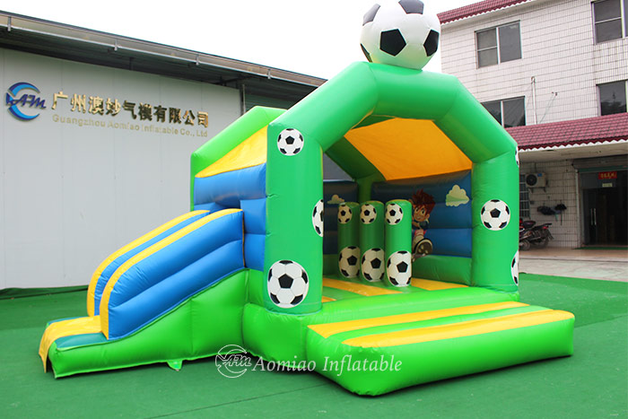 Football bouncy castle slide combo